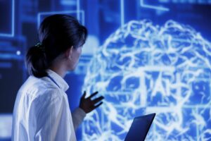 Pessoa analisando um cérebro digital em tela tecnológica, representando o que é neurociência no contexto da inteligência artificial.